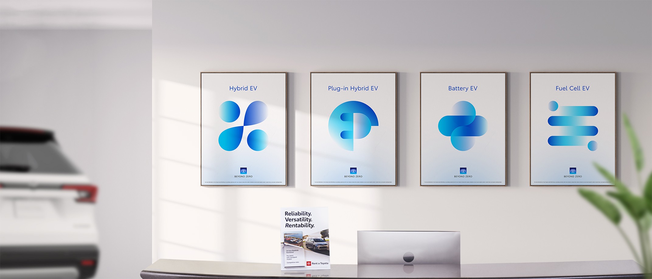 Image of signage in a Toyota dealership that has the illustrative graphics displayed at a large scale  and the Beyond Zero logo at the bottom of the layout.