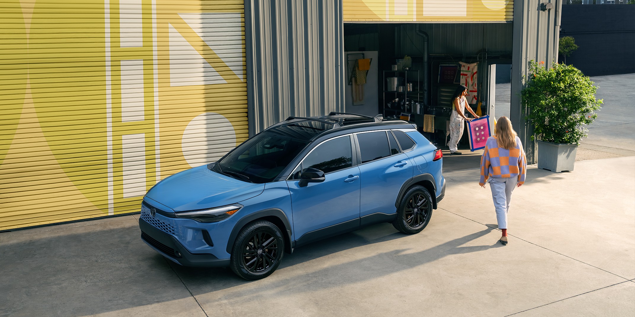 A slider divides an image of a Blue car in half, showing what it looks like when the contrast is increased to the image.