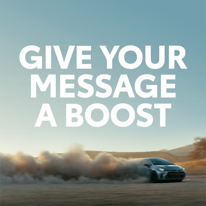 A super reading ”GIVE YOUR MESSAGE A BOOST” over an image of a vehicle kicking up dust.