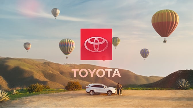 Image of vehicle with hot-air balloons with the Toyota logo appearing in the center of the image.