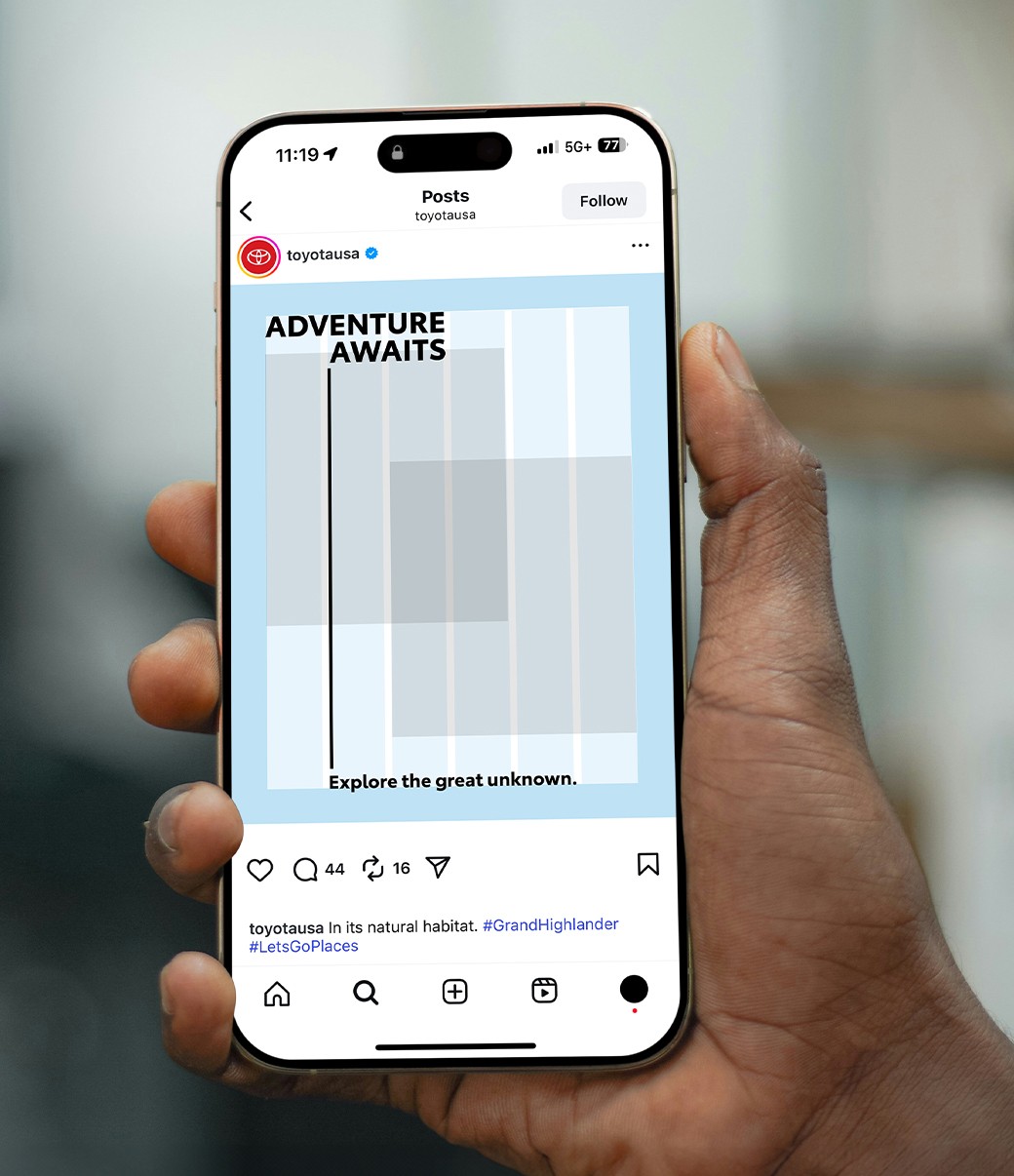 A slider divides an image of a hand holding a phone with a Toyota social media post. The slider moves back and forth to show a layout grid of the post and then the finished post with imagery.
