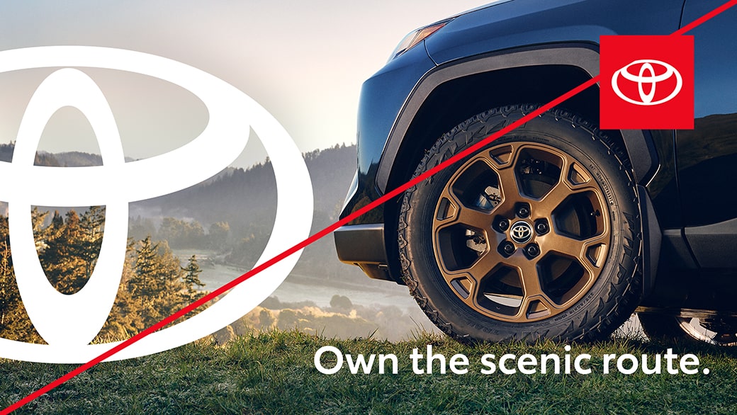 Example ad showing incorrect usage with the Toyota staging platform used by itself in the corner and a large white emblem on the left of the image.