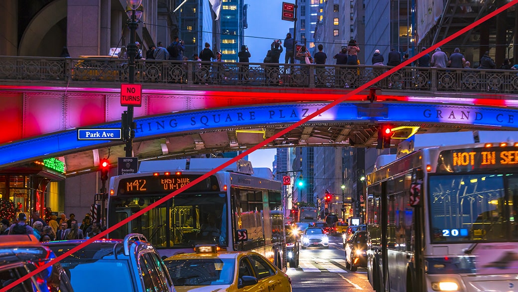 An image of a busy city scene at night with buses and colorful lights, representing an incorrect composition.